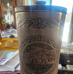 Vintage Metal Canister with Ship Design